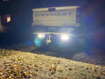 2020-Current Chevy GMC 2500 3500 Hitch Bar Reverse 7in LED Flood Lighting Heavy Duty Bolt-On Blacked Out Kit with Heated Lens and Dual End Light Cap